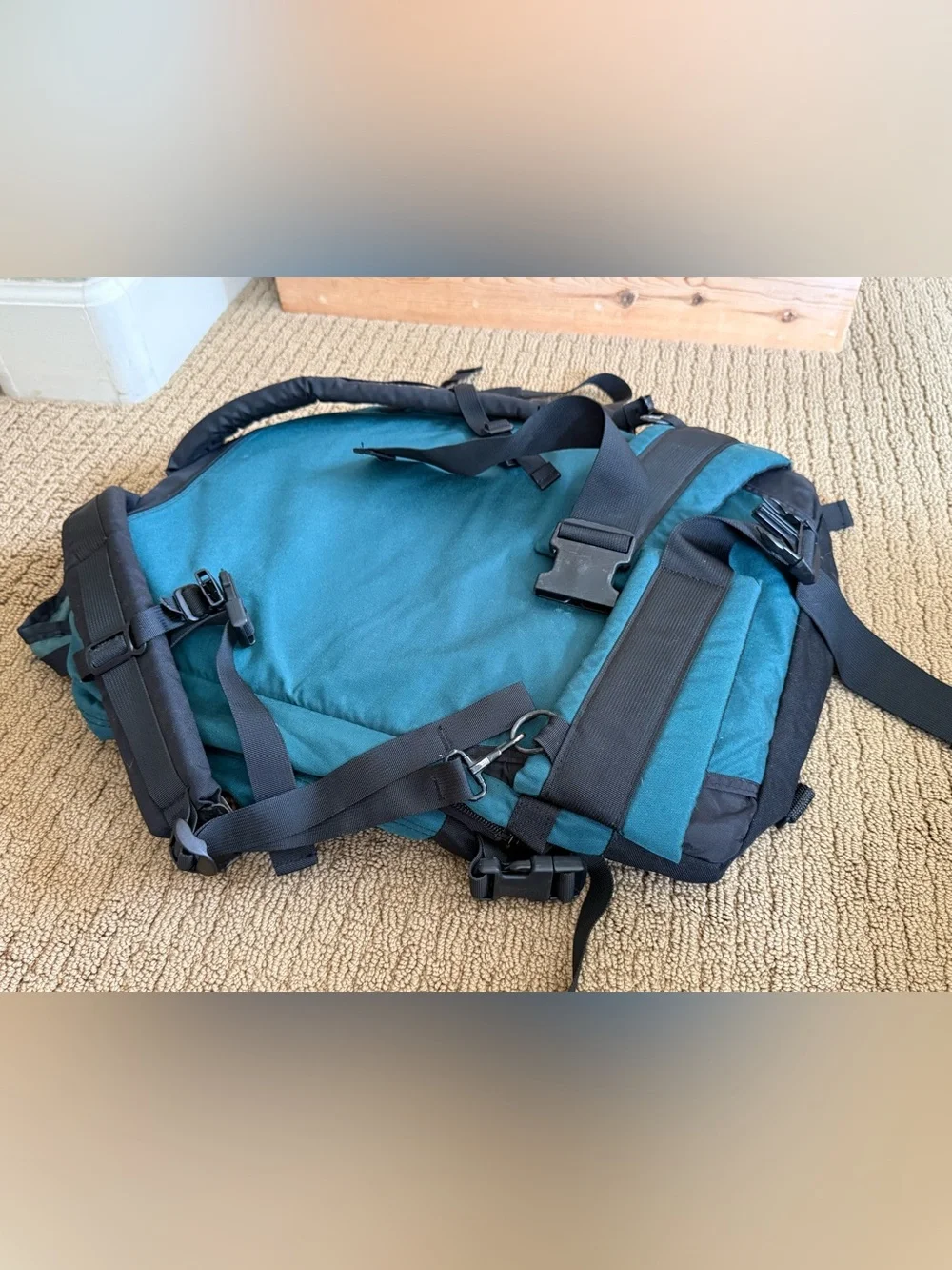 Teal and Black Vintage Eagle Creek Backpack with a day pack attached.